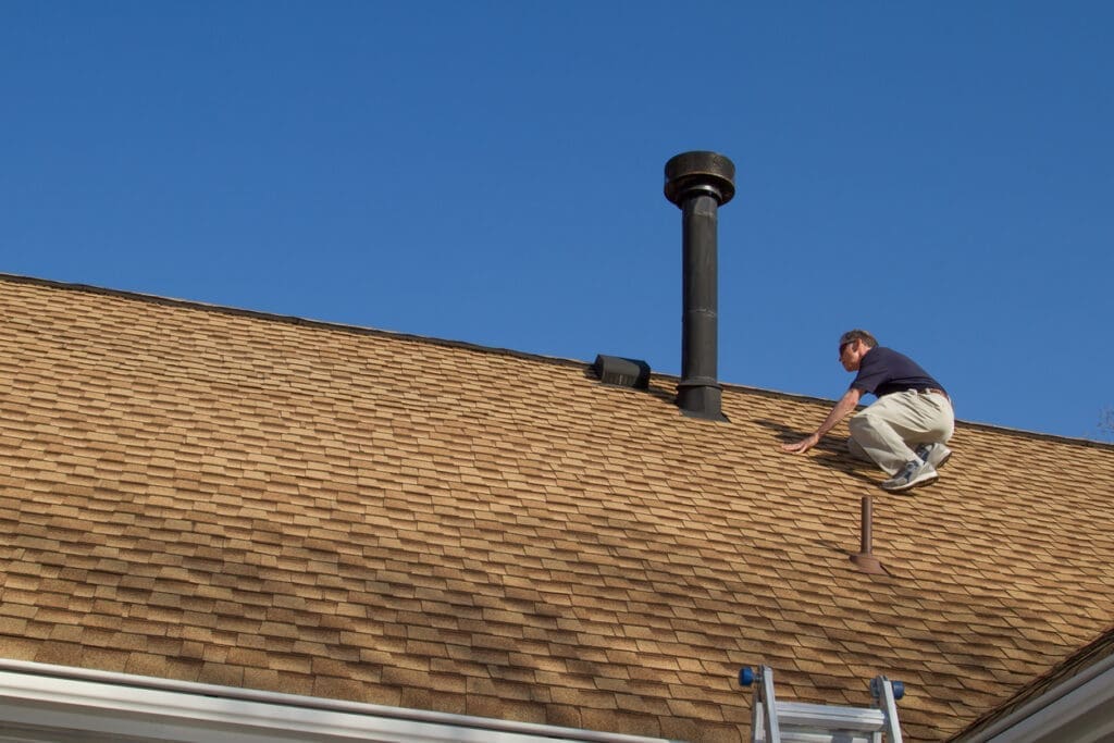 Roofing contractor installing new roof