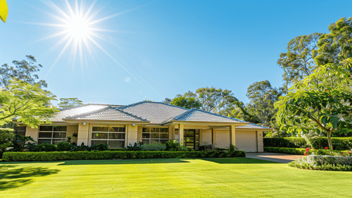 Beautiful home with green lawn and new roof on a sunny day