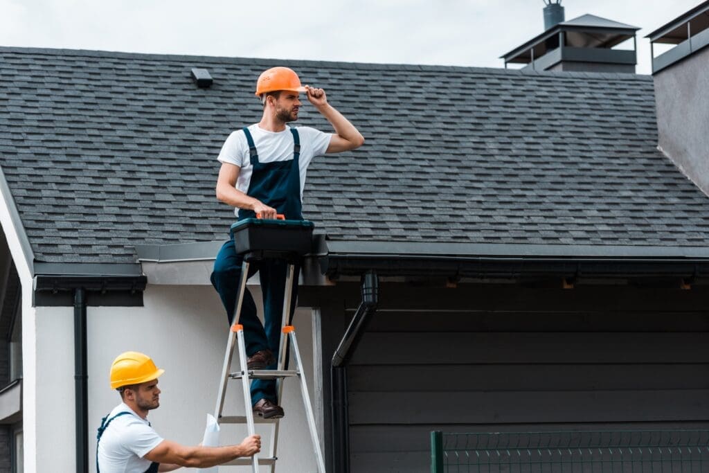 Expert Roofer from Eternal Roofing Fixing Shingles on a Roof in Schertz, TX.