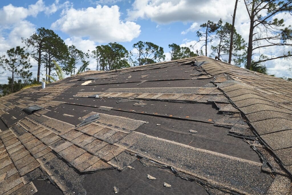 Eternal Roofing team performing emergency storm damage repair on a roof in Austin, TX, focusing on hail and wind damage restoration.