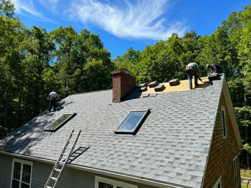 Eternal Roofing Team Installing Diverse Roofing Materials on a Home in Austin, TX.