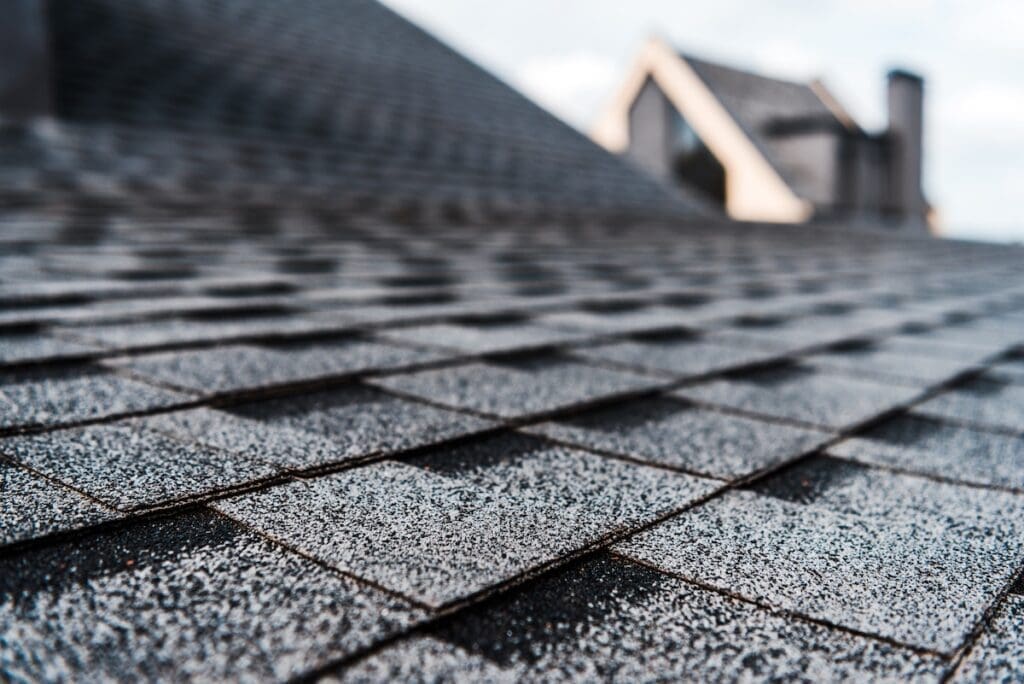 Expert roofer from Eternal Roofing fixing shingles and flashing in Beecave, TX to prevent further roof damage.